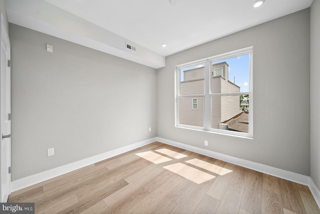 spare room featuring light wood-type flooring