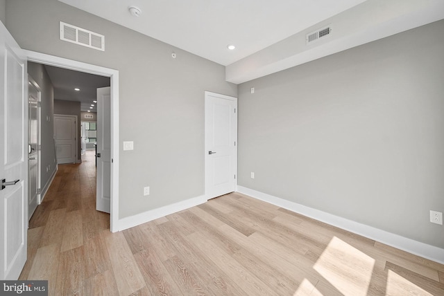 spare room featuring light wood-type flooring