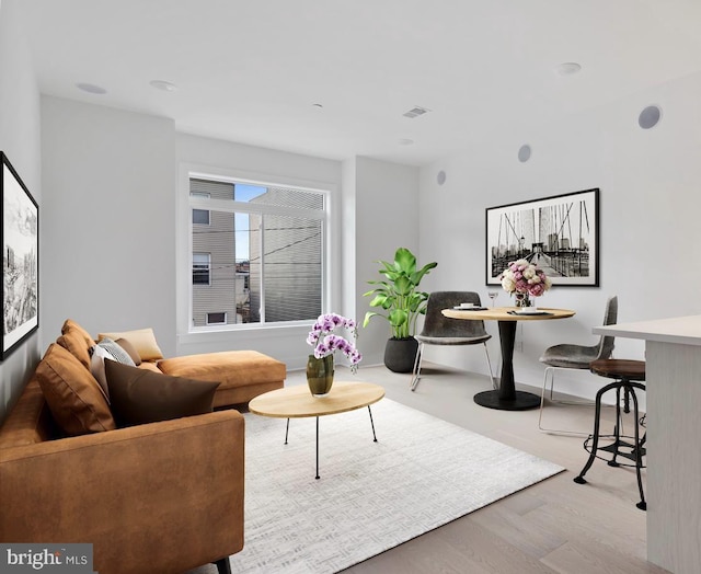 living room with light hardwood / wood-style floors