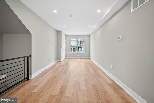 unfurnished living room with light wood-type flooring