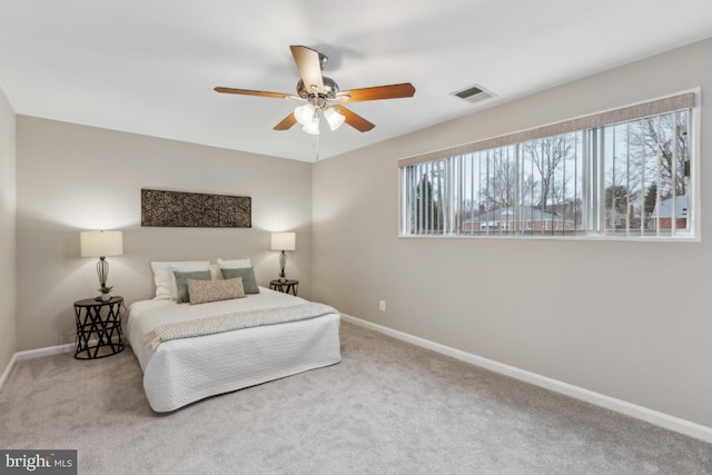 bedroom with ceiling fan and carpet floors