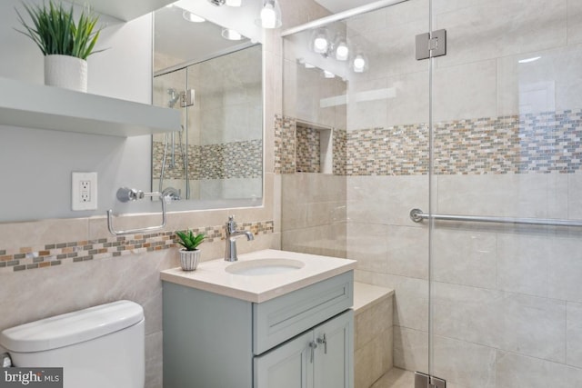 bathroom with vanity, toilet, and walk in shower