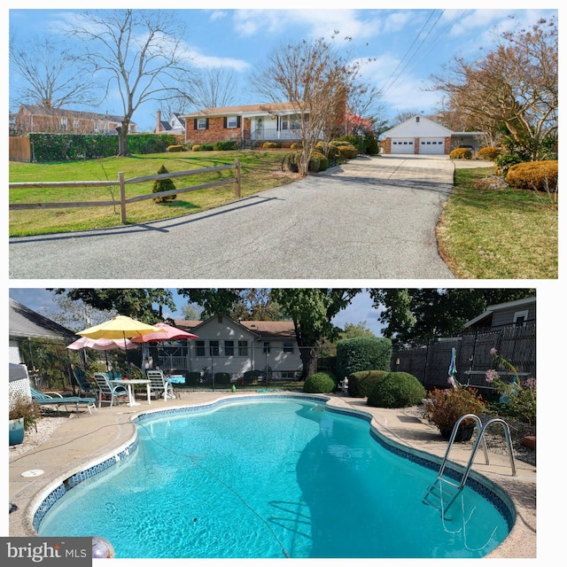 view of swimming pool with a lawn