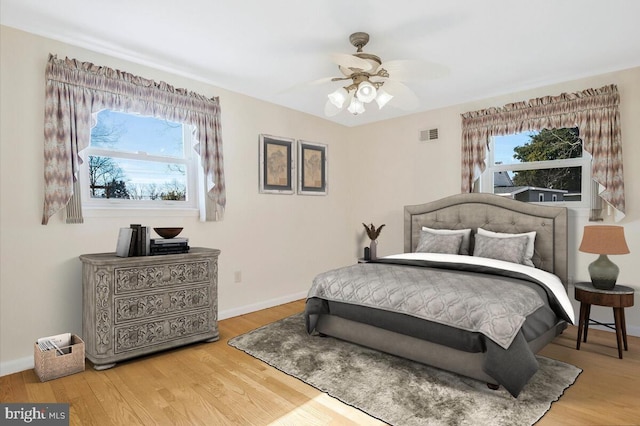 bedroom featuring hardwood / wood-style flooring and ceiling fan