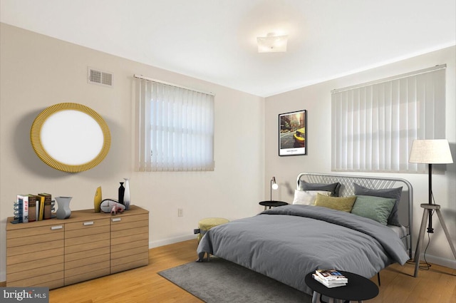 bedroom with light hardwood / wood-style floors