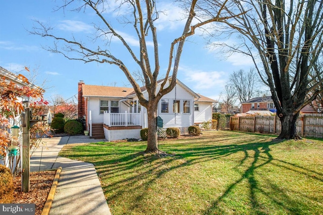 exterior space featuring covered porch and a lawn