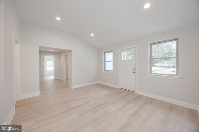 entrance foyer featuring light wood finished floors, lofted ceiling, recessed lighting, visible vents, and baseboards