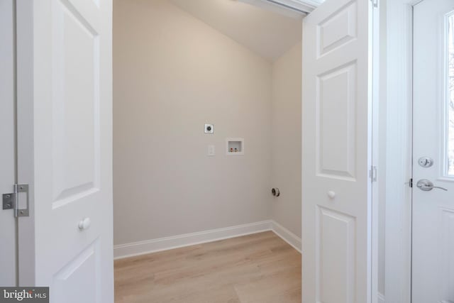 laundry room featuring laundry area, light wood finished floors, baseboards, hookup for a washing machine, and hookup for an electric dryer