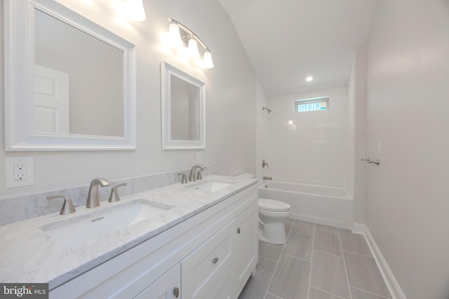 bathroom featuring shower / washtub combination, a sink, toilet, and double vanity