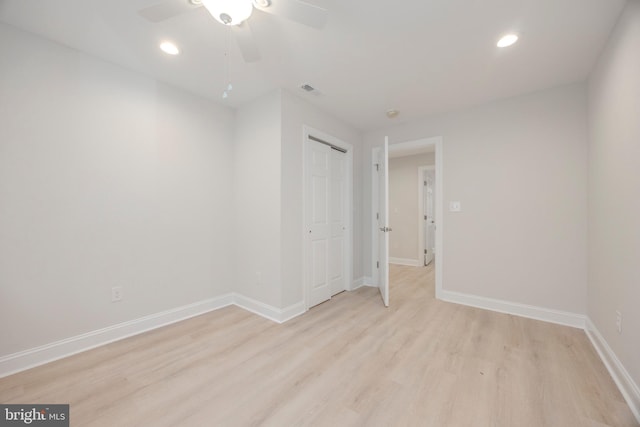 unfurnished bedroom featuring baseboards, recessed lighting, and light wood-style floors