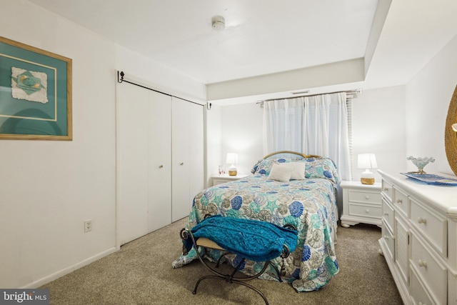 carpeted bedroom featuring a closet