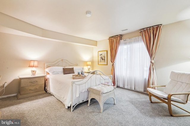 bedroom with light colored carpet