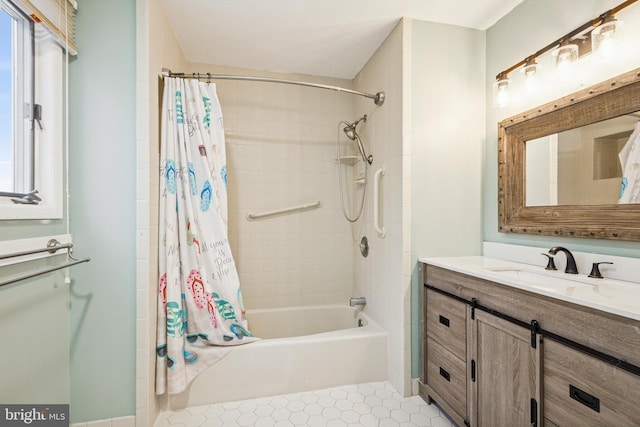 full bathroom with shower / bath combo, vanity, and tile patterned floors