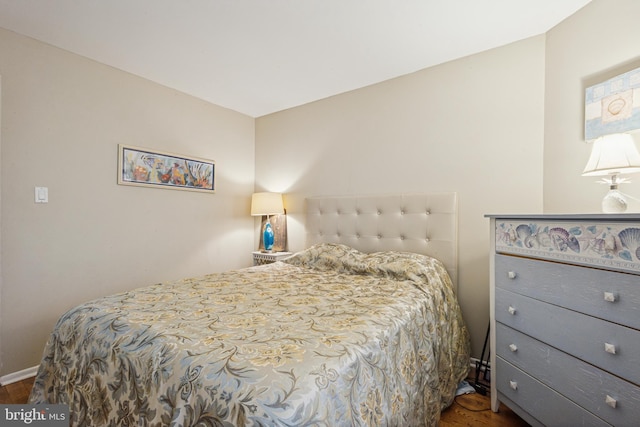 bedroom featuring wood finished floors