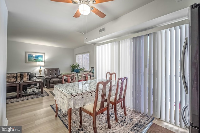 dining room featuring ceiling fan and light hardwood / wood-style floors