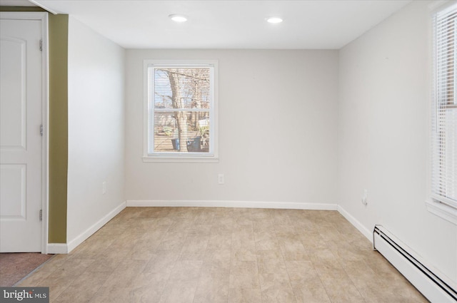 unfurnished bedroom featuring baseboard heating