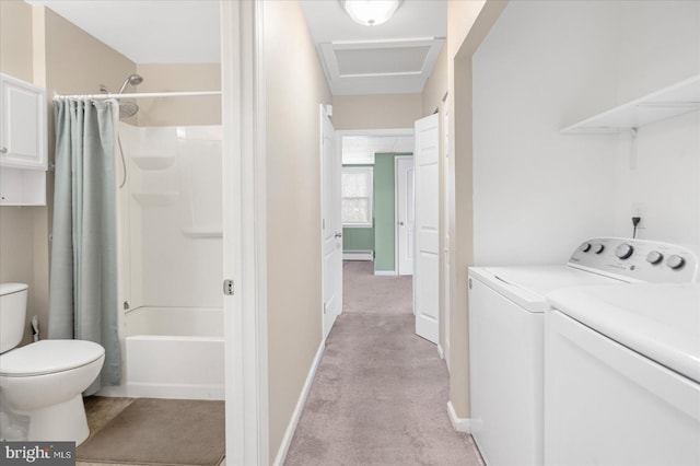 washroom featuring baseboard heating, light colored carpet, and separate washer and dryer