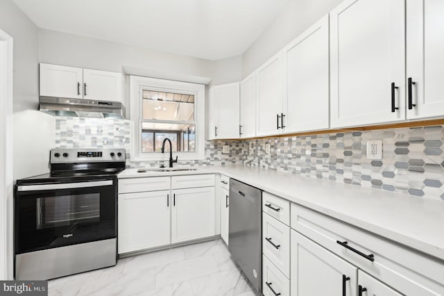 kitchen with white cabinets, under cabinet range hood, stainless steel appliances, and light countertops