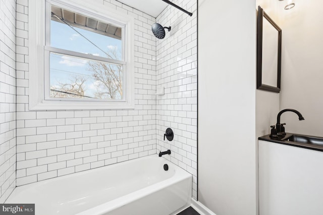 full bath with  shower combination and a sink