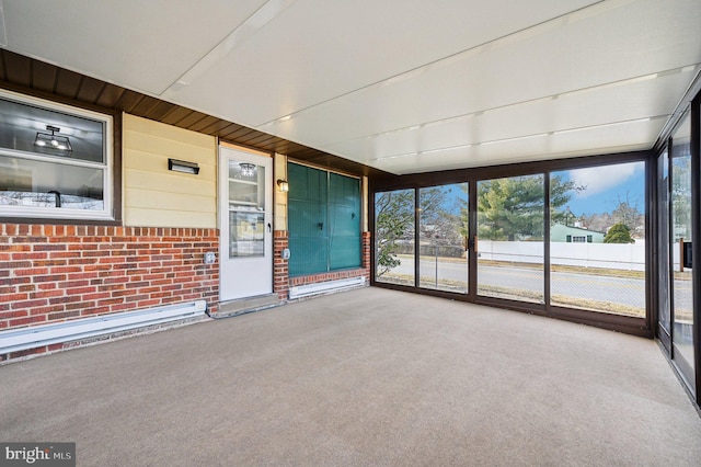 unfurnished sunroom with a baseboard radiator