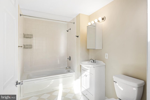 bathroom with washtub / shower combination, vanity, and toilet