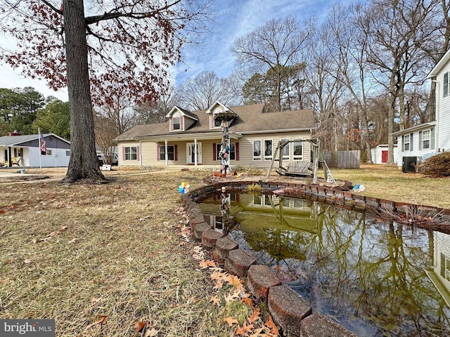 back of property featuring a yard