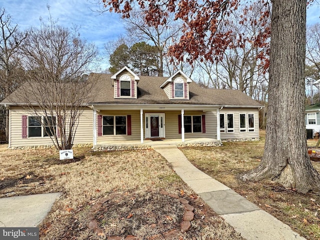 cape cod-style house with a porch