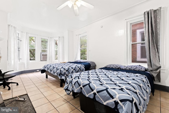 bedroom with light tile patterned floors and ceiling fan