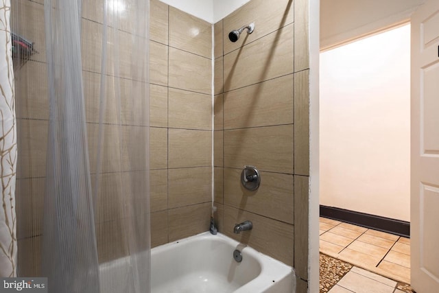 bathroom featuring tile patterned flooring and shower / bath combo