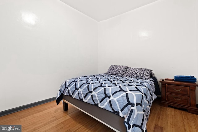 bedroom with light hardwood / wood-style floors