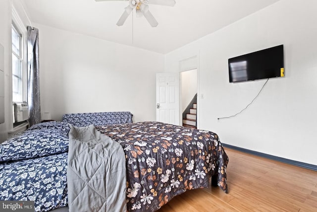 bedroom featuring hardwood / wood-style flooring and ceiling fan