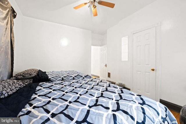 bedroom featuring hardwood / wood-style flooring and ceiling fan