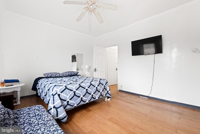 bedroom featuring wood-type flooring and ceiling fan