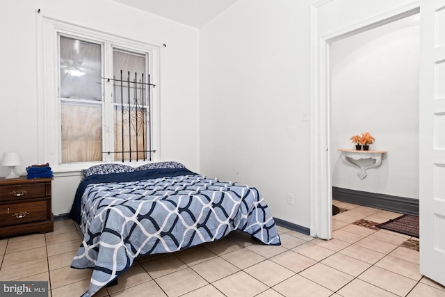 bedroom with light tile patterned floors