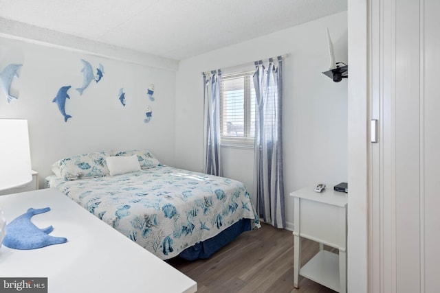 10300 Coastal Hwy Unit 104, Ocean City, MD 21842 - bedroom featuring dark wood-style flooring