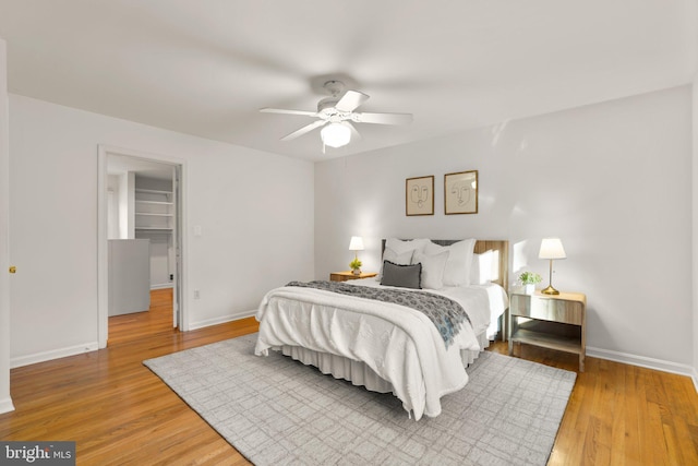 bedroom featuring hardwood / wood-style floors and ceiling fan