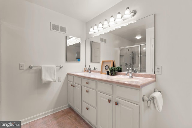 bathroom featuring walk in shower, tile patterned floors, and vanity