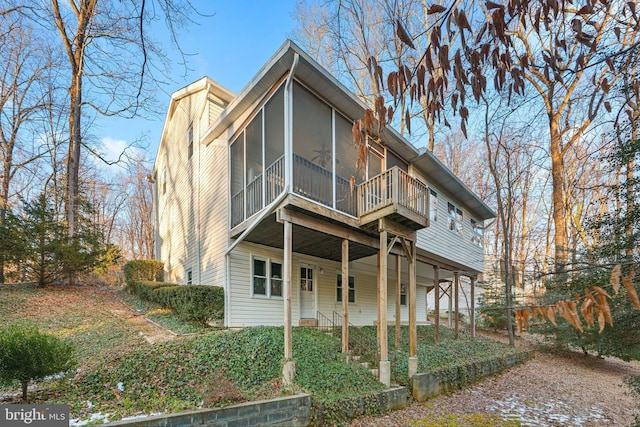 view of front of property featuring a sunroom