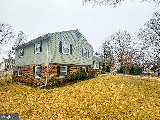 view of property exterior with a lawn