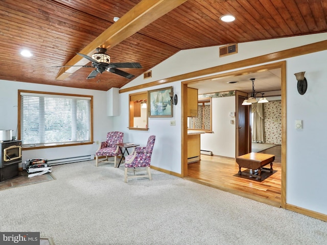 living area featuring vaulted ceiling, a baseboard radiator, a wood stove, carpet, and wooden ceiling