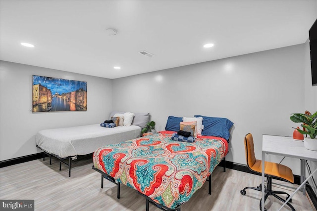 bedroom featuring light hardwood / wood-style flooring