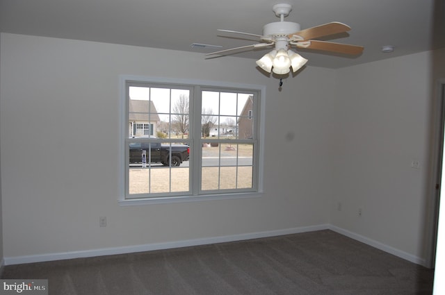 unfurnished room featuring baseboards, ceiling fan, carpet, and a healthy amount of sunlight