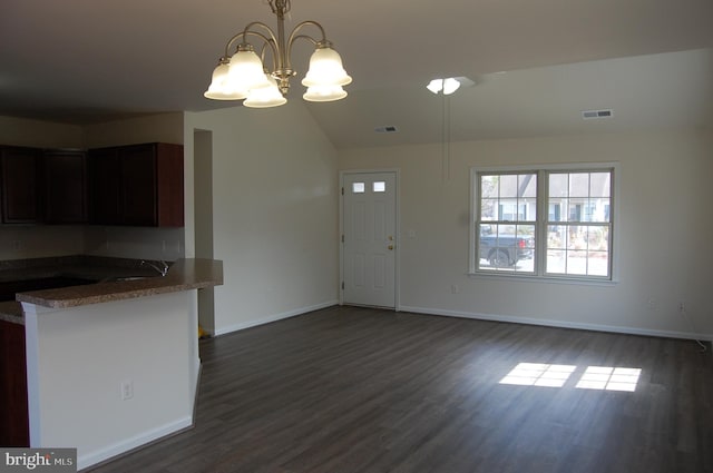 interior space featuring dark wood-style floors, visible vents, and baseboards