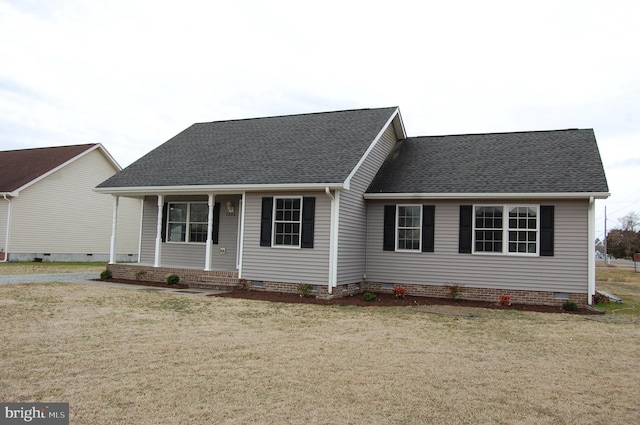 ranch-style house with crawl space, a front lawn, and roof with shingles