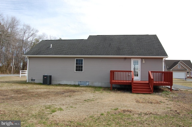 rear view of house featuring crawl space, roof with shingles, a wooden deck, and central air condition unit