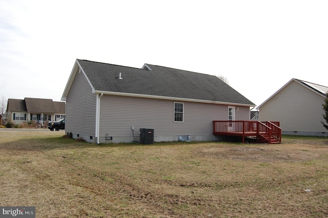 back of house with central air condition unit, a yard, crawl space, roof with shingles, and a wooden deck