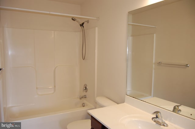 full bath with bathtub / shower combination, vanity, and toilet