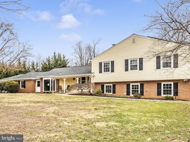 tri-level home with a front lawn