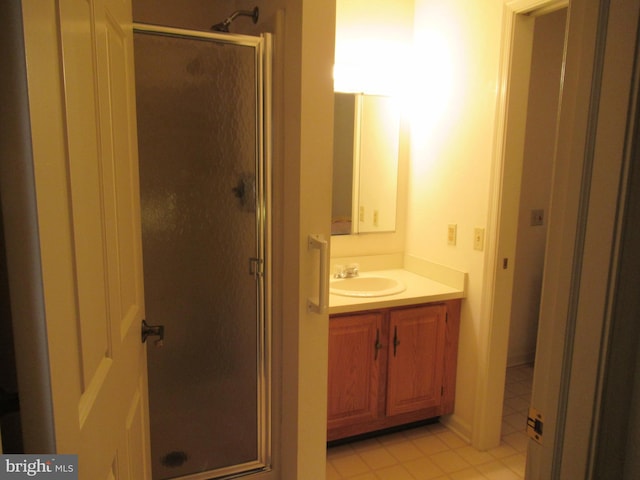 bathroom featuring an enclosed shower and vanity