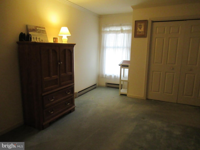 bedroom with crown molding, carpet floors, and baseboard heating